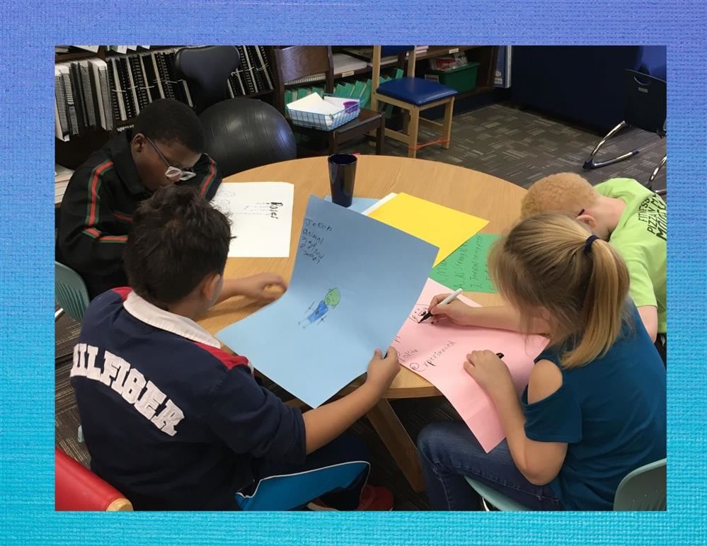 Students working on a poetry assignment in the media center.