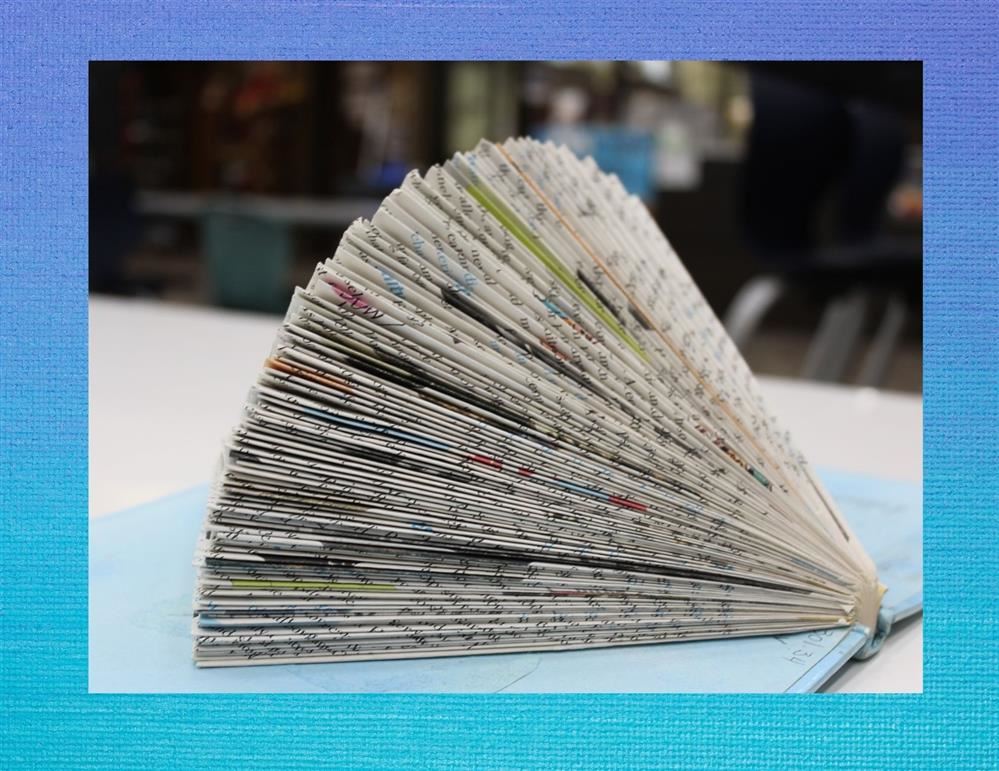 Book that has been used to create art work by folding the pages.